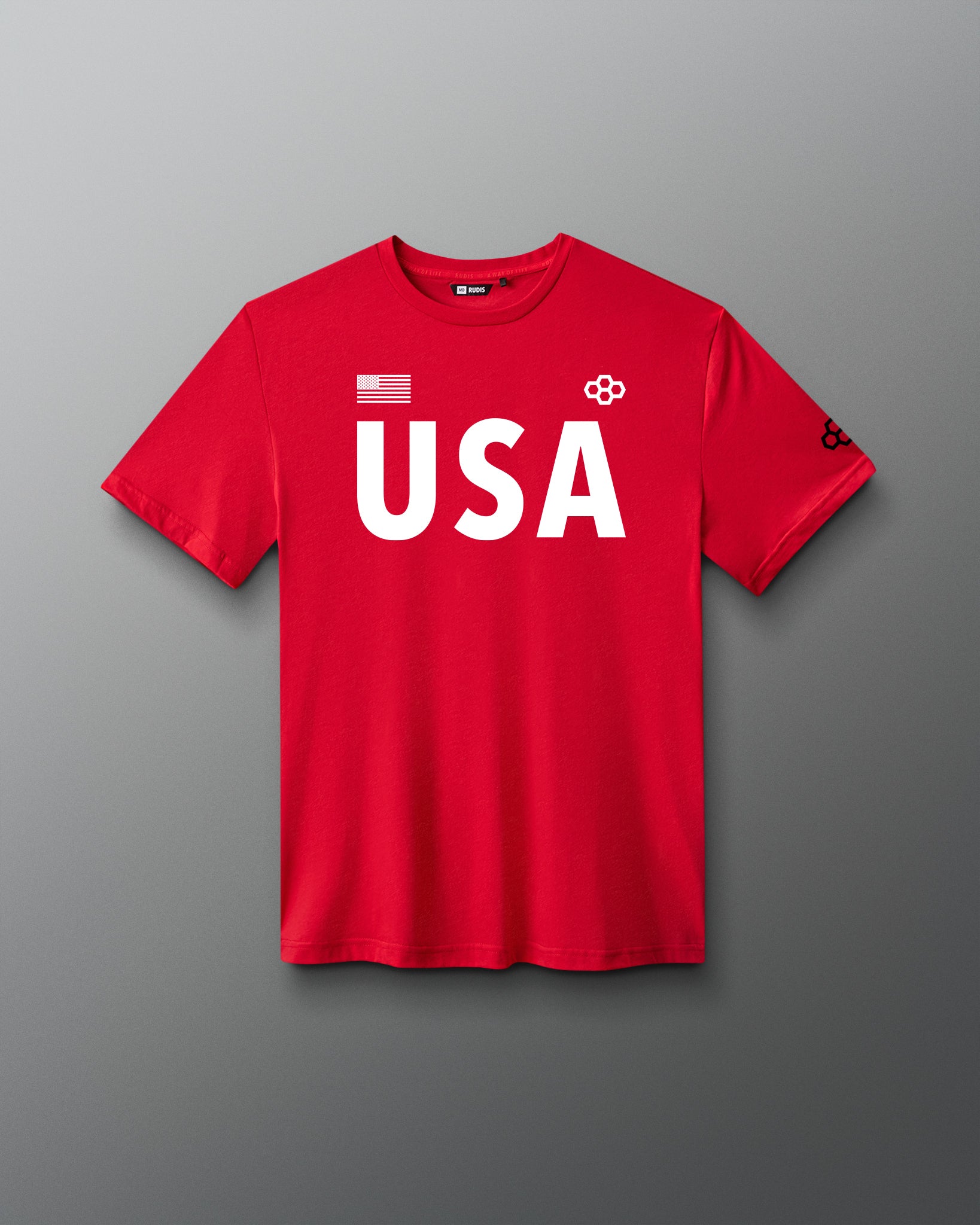 Front view of RUDIS USA Elite Super Soft T-Shirt in red, featuring bold white USA lettering, American flag graphic, RUDIS Hex logos, and crewneck design.
