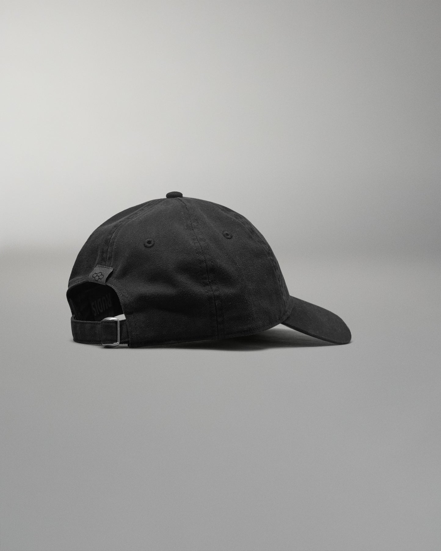 Black cap on a gray background