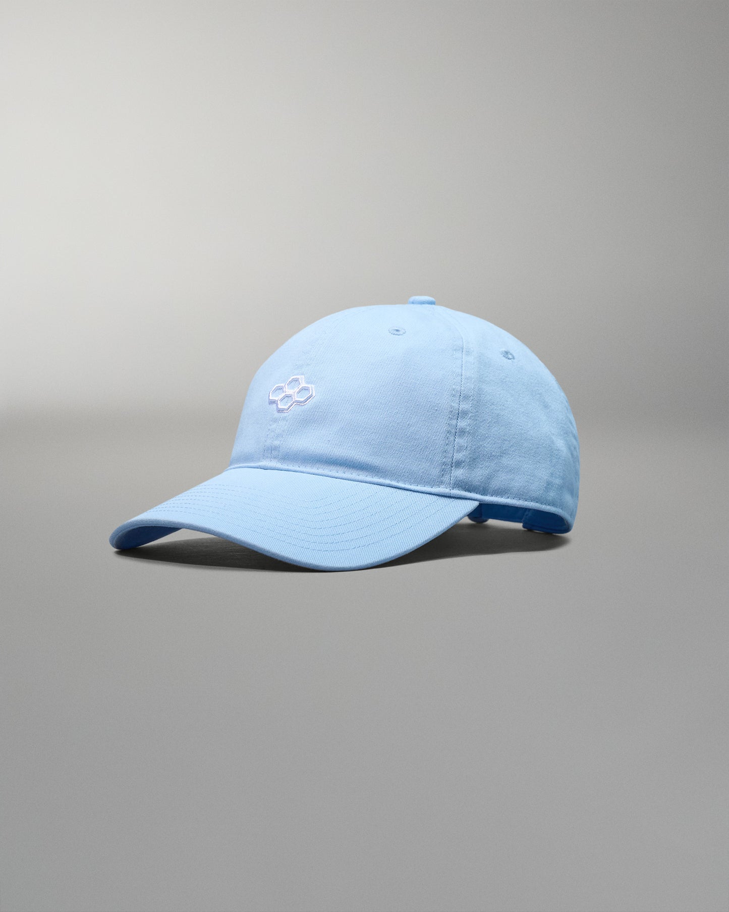 Light blue baseball cap on a gray background