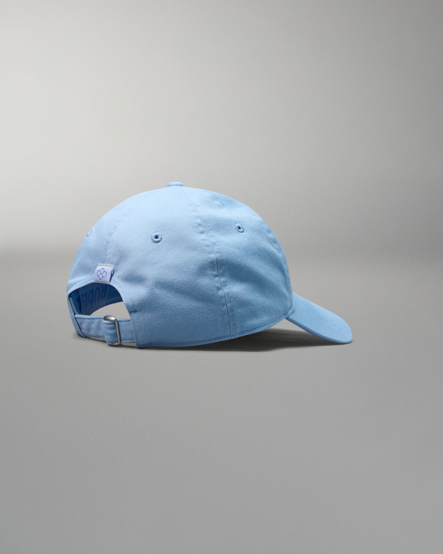 Light blue baseball cap on a gray background