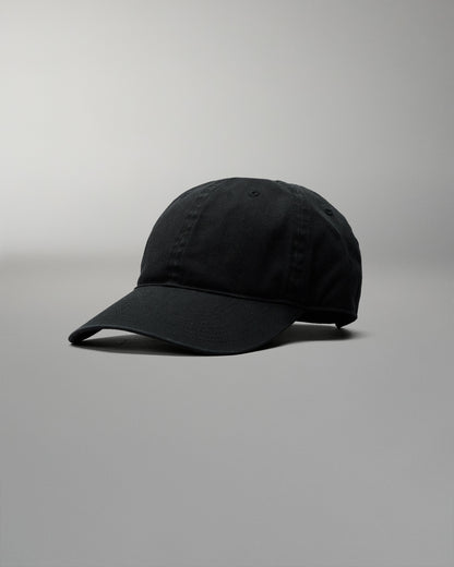 Black baseball cap on a gray background