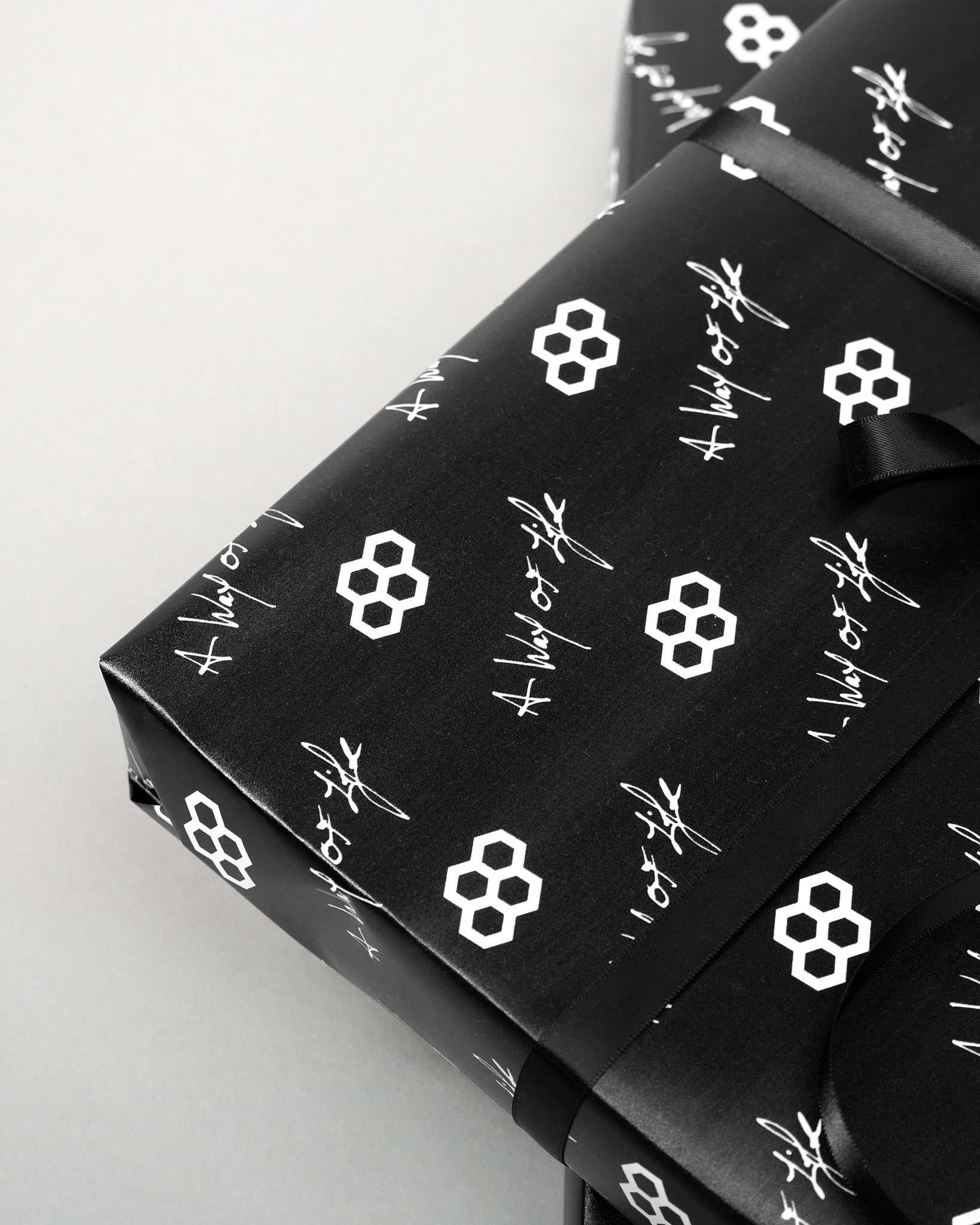 Black fabric with white geometric patterns on a light gray background