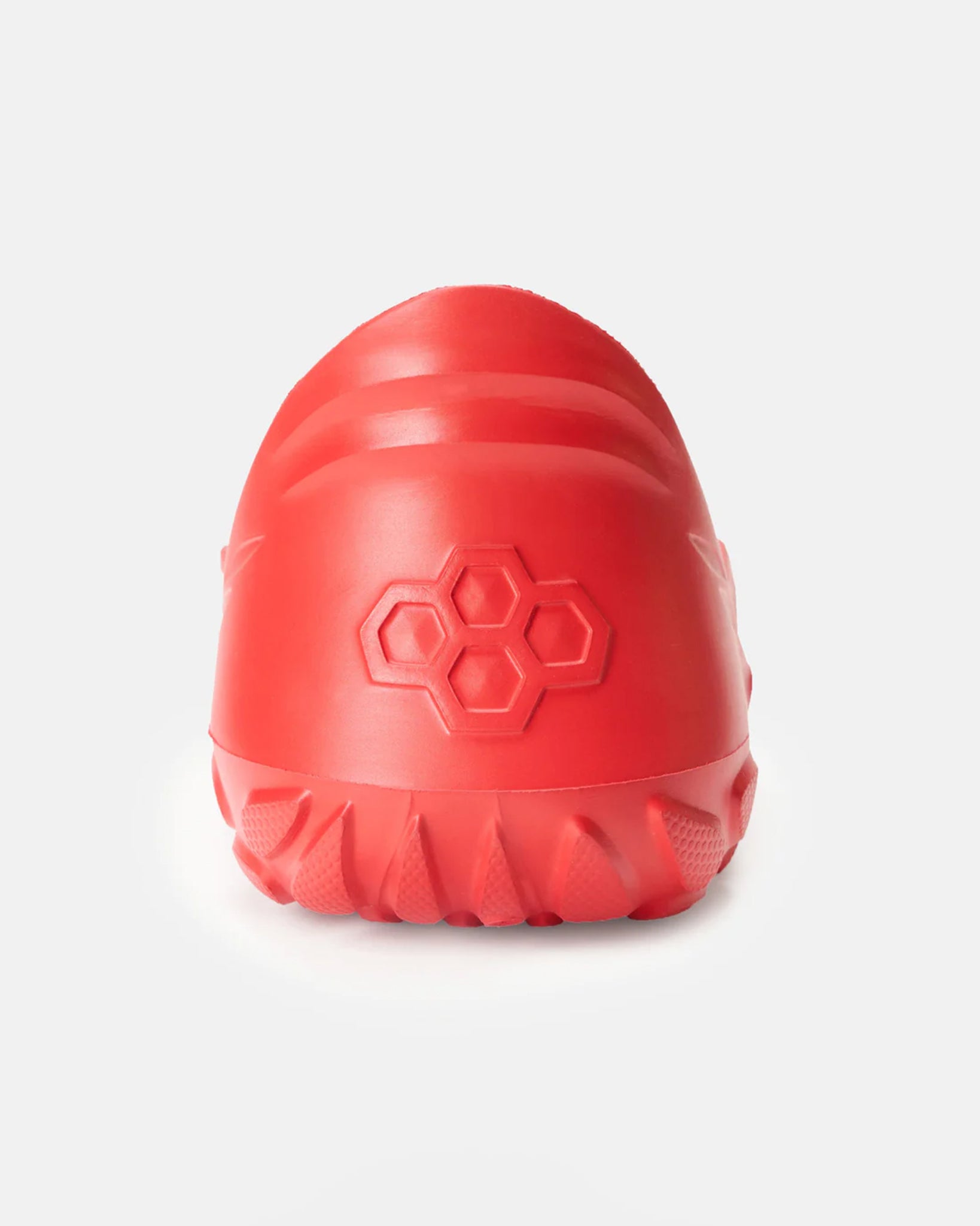 A bright red shoe heel features a textured sole and a unique hexagonal pattern on the back