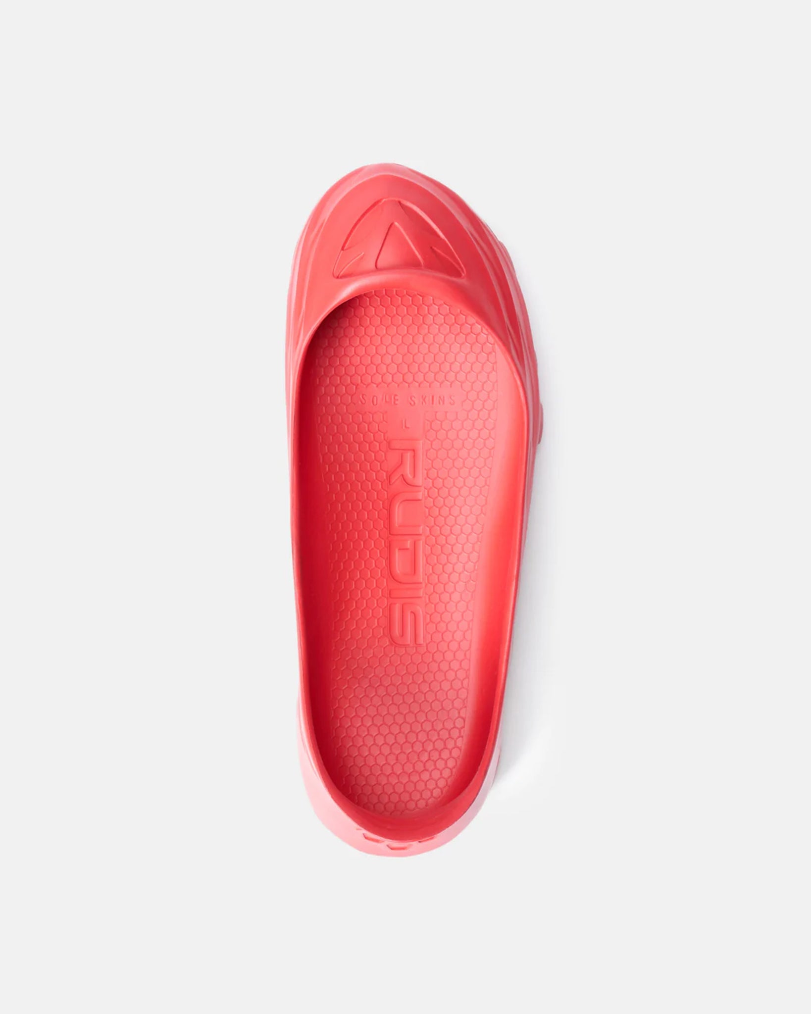 A vibrant red slip-on shoe with a textured sole and a sleek design ideal for casual use and comfort