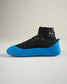 A modern black and blue athletic shoe with a unique design featuring a high-top silhouette and distinctive sole
