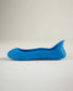 A sleek blue slip-on shoe with a minimalist design and contoured shape perfect for casual or light outdoor activities