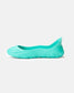 A side view of a vibrant turquoise womens slip-on shoe with a sleek modern design and textured sole