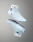 Light blue wrestling shoes with white laces on a gray background