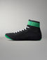 Black wrestling shoe with green accents on a gray background