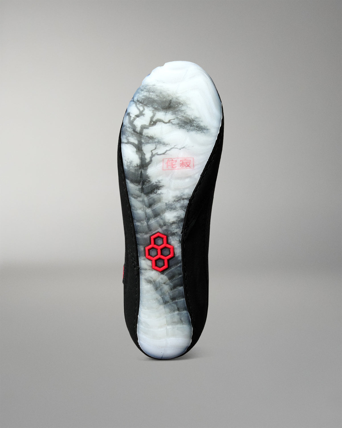 Bottom view of the RUDIS Samurai Speed Wabi-Sabi wrestling shoe, featuring a translucent outsole with black Japanese landscape artwork and a red RUDIS emblem.