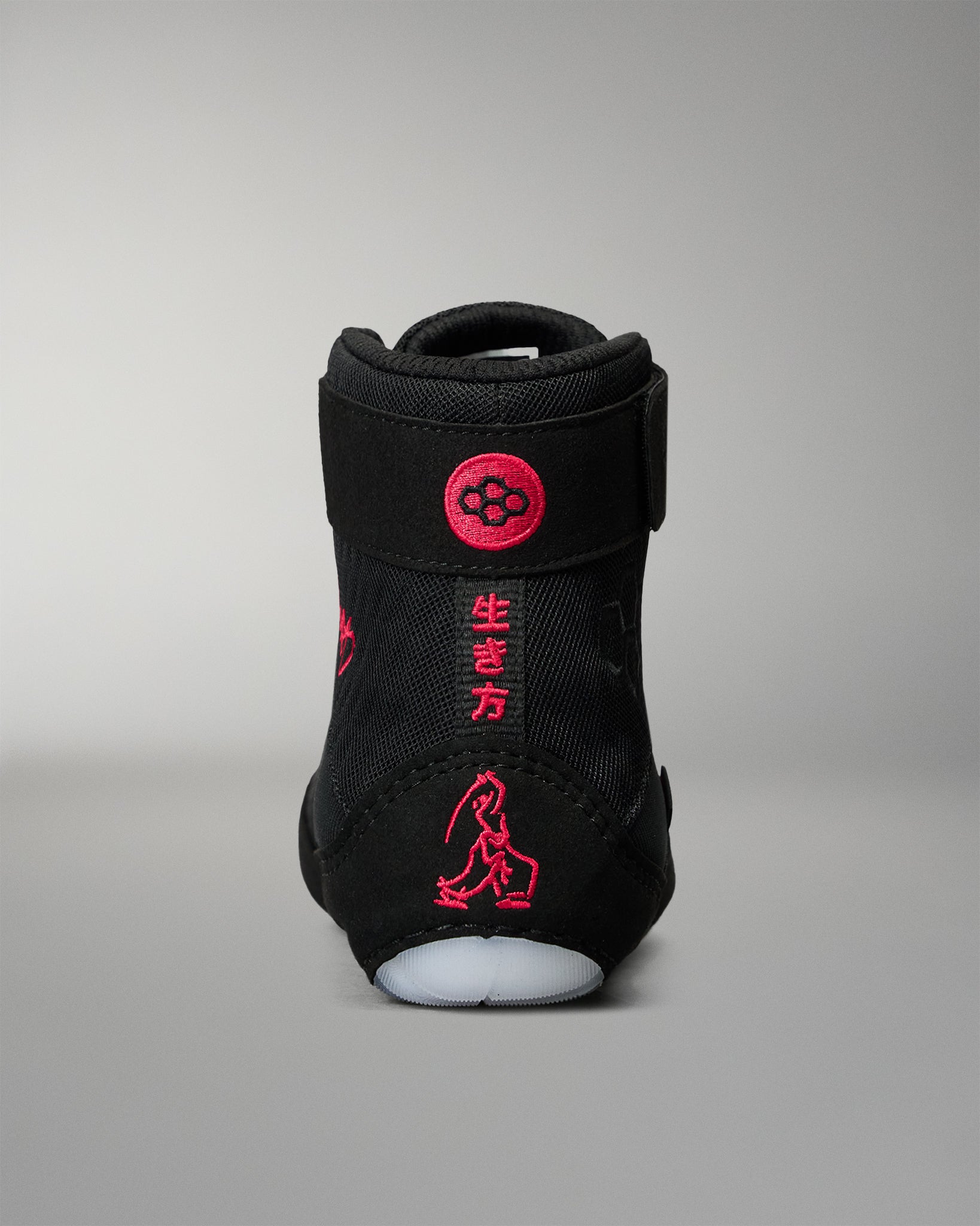 Rear view of the RUDIS Samurai Speed Wabi-Sabi wrestling shoe in black, highlighting red embroidered Japanese characters, wrestling graphics, and RUDIS heel branding.