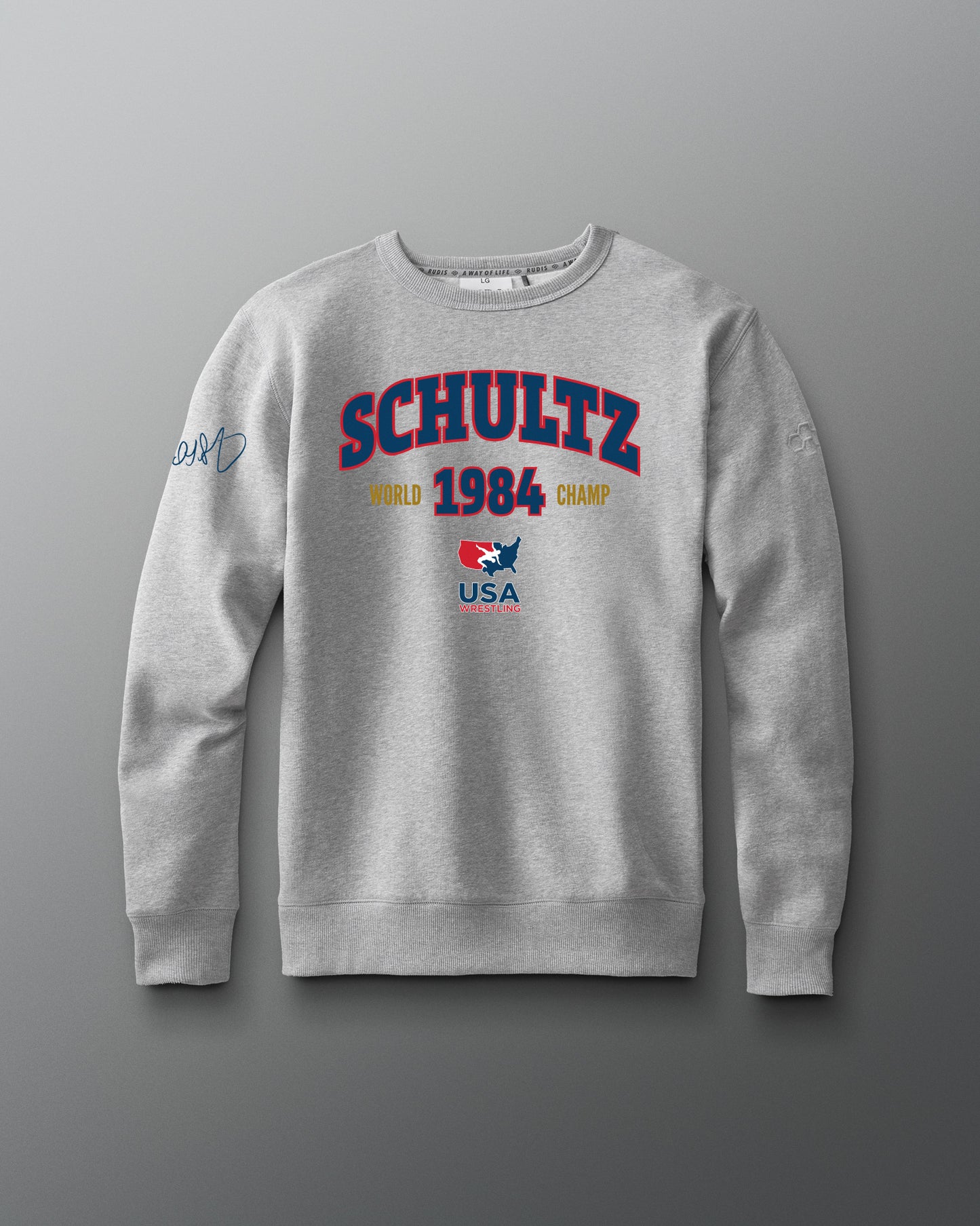 Gray sweatshirt with 'Schultz' branding on a gray background