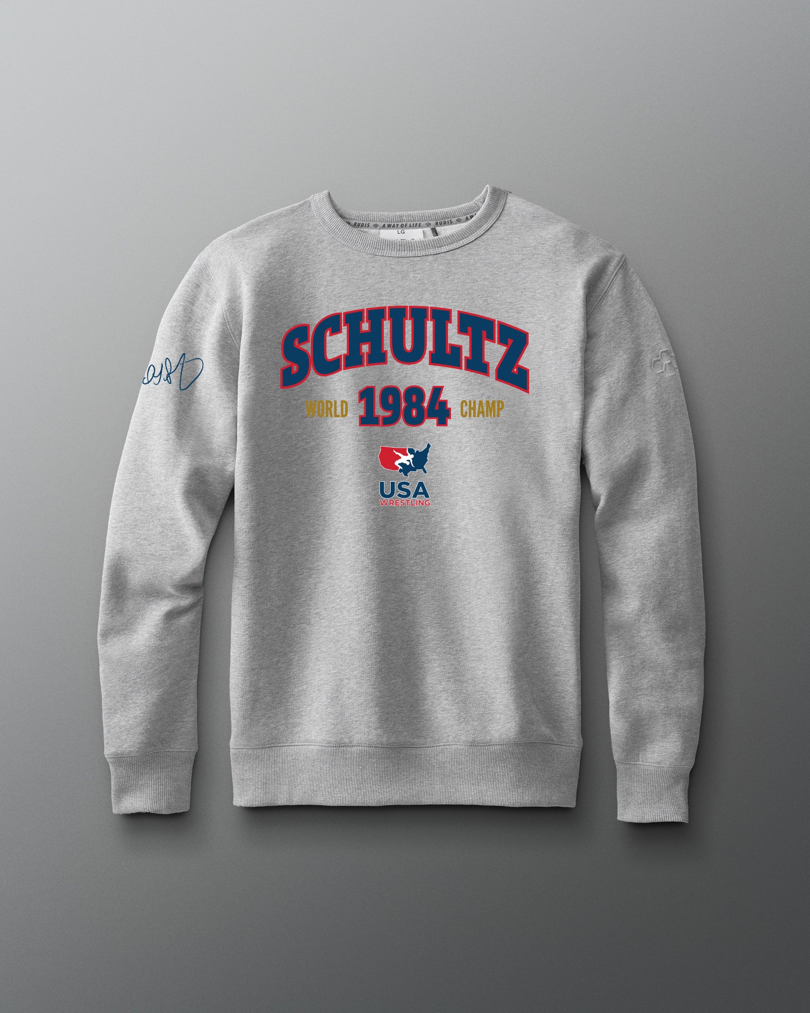 Gray sweatshirt with 'Schultz' branding on a gray background