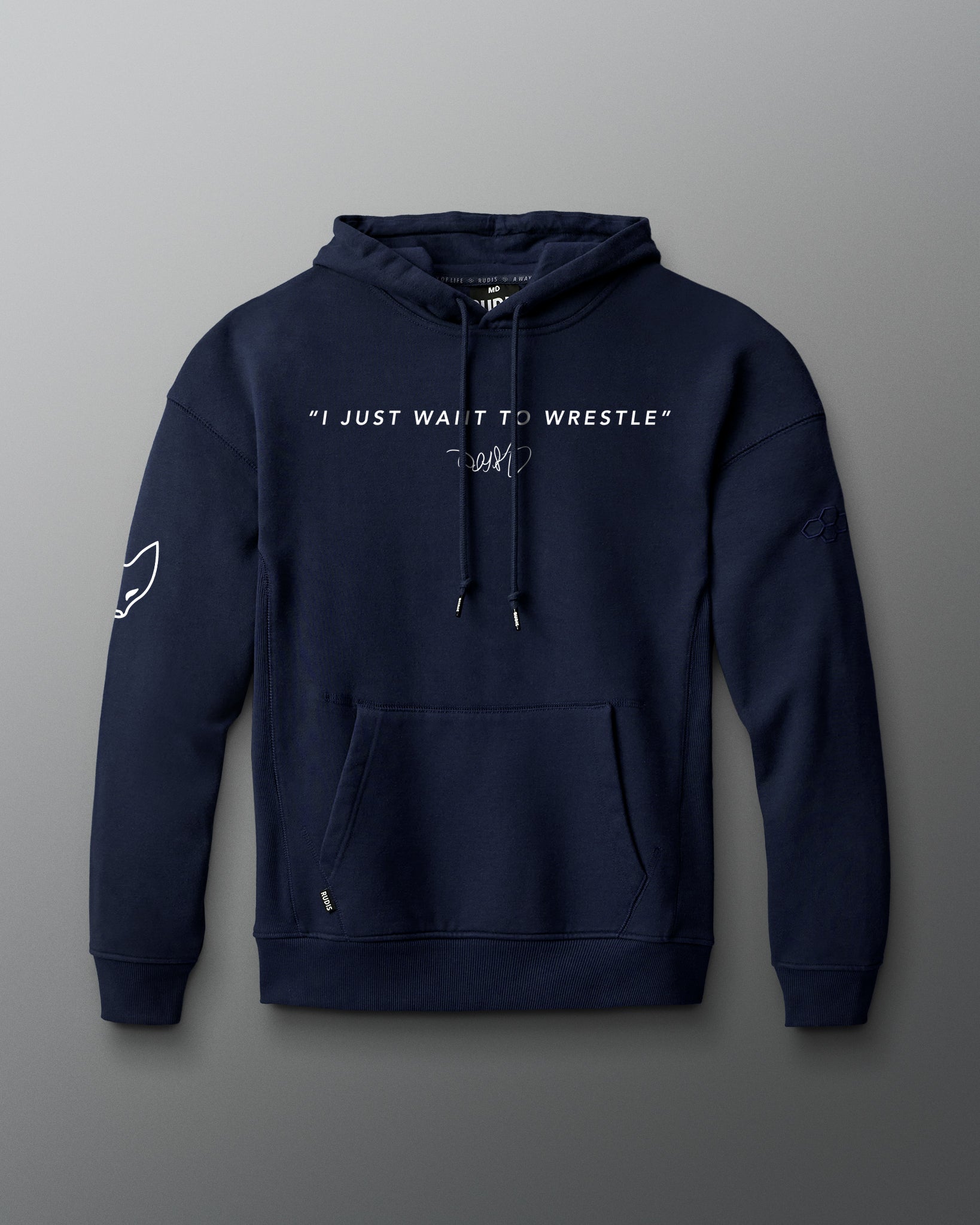 Front view of a navy hoodie featuring the phrase “I JUST WANT TO WRESTLE” in white block letters across the chest, with a signature printed below. Includes a front kangaroo pocket and subtle graphics on both sleeves.