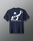 Back view of a navy t-shirt featuring a bold, high-contrast graphic of a victorious wrestler raising his arm. Below the image, the phrase “THE LEGEND LIVES ON…” is printed in white capital letters.