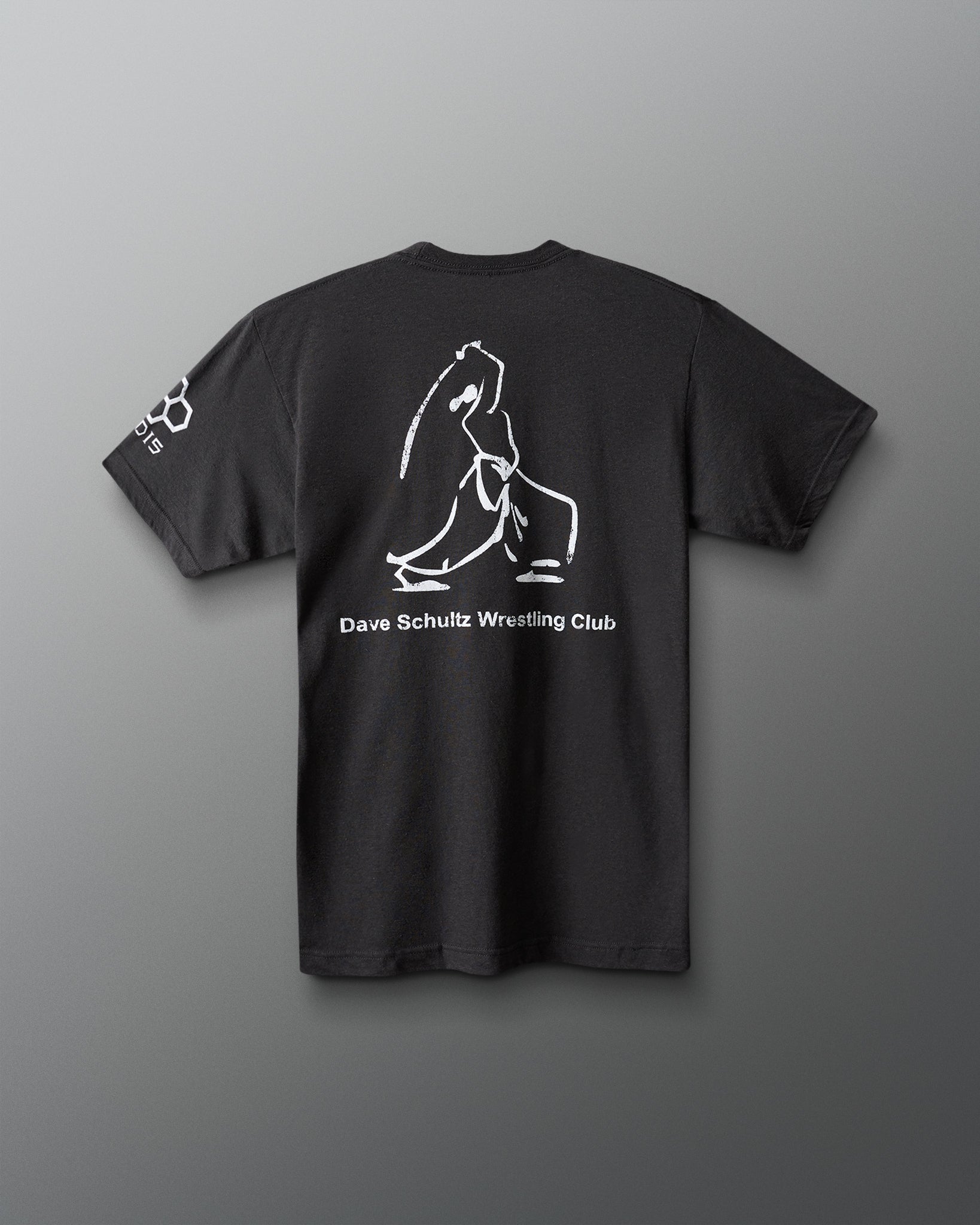 Black t-shirt with white graphic and text on a gray background