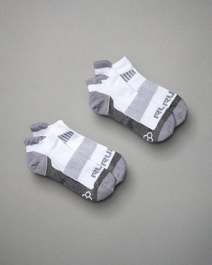A pair of ankle sports socks featuring a modern design with a white upper and gray accents ideal for athletic wear