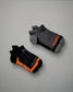 This image features two pairs of athletic socks one in black with orange accents and the other in gray with black details both designed for comfort and performance