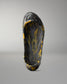 Top view inside the RUDIS black and yellow wrestling shoe cover showing the honeycomb-textured footbed and RUDIS branding.