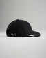 A simple black baseball cap viewed from the side showcasing its curved brim and adjustable strap at the back