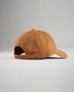 A stylish brown baseball cap with a relaxed fit featuring a soft fabric and an adjustable strap for comfort