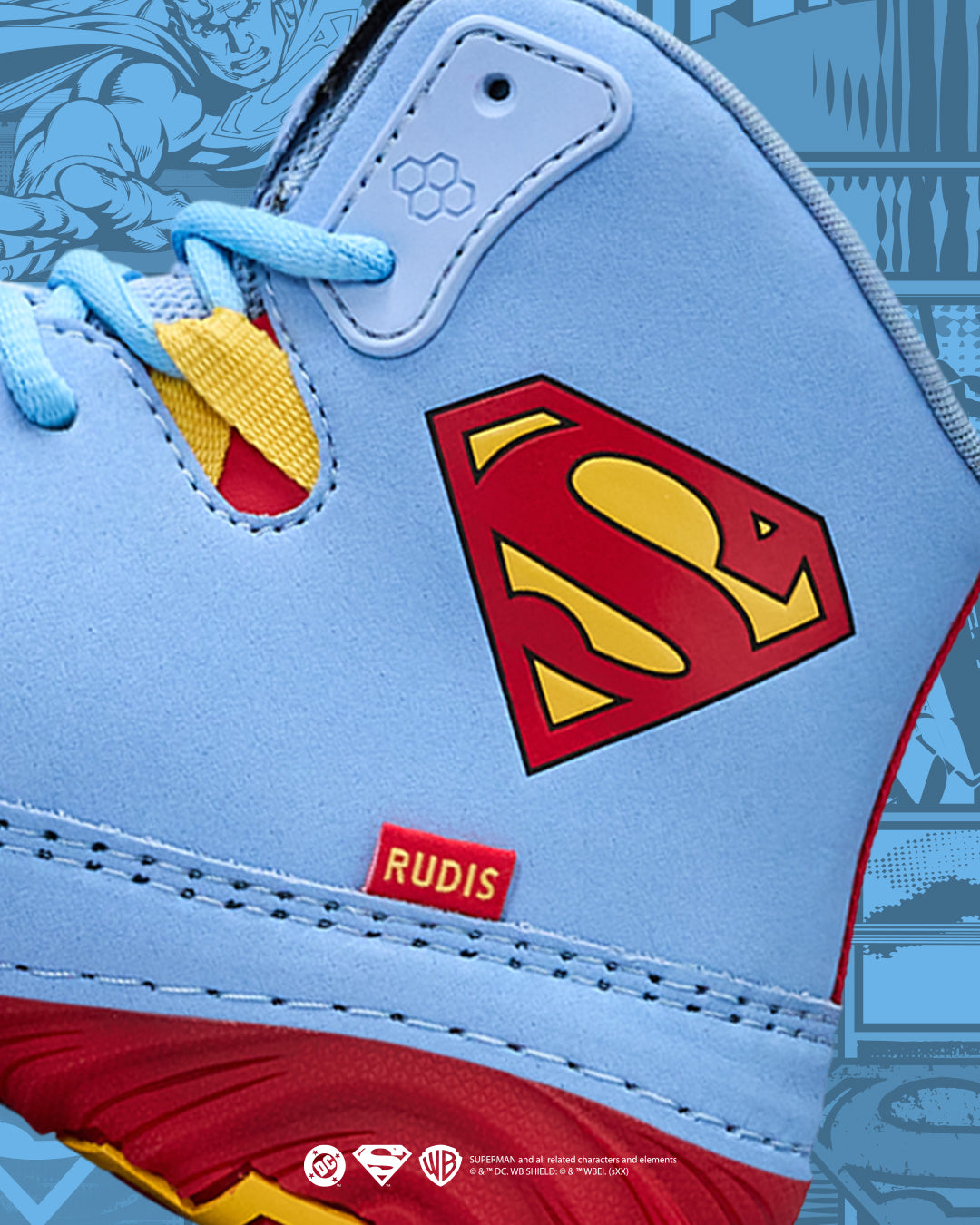Superman logo on a light blue wrestling shoe with red and yellow accents, featuring the brand 'Rudis'.