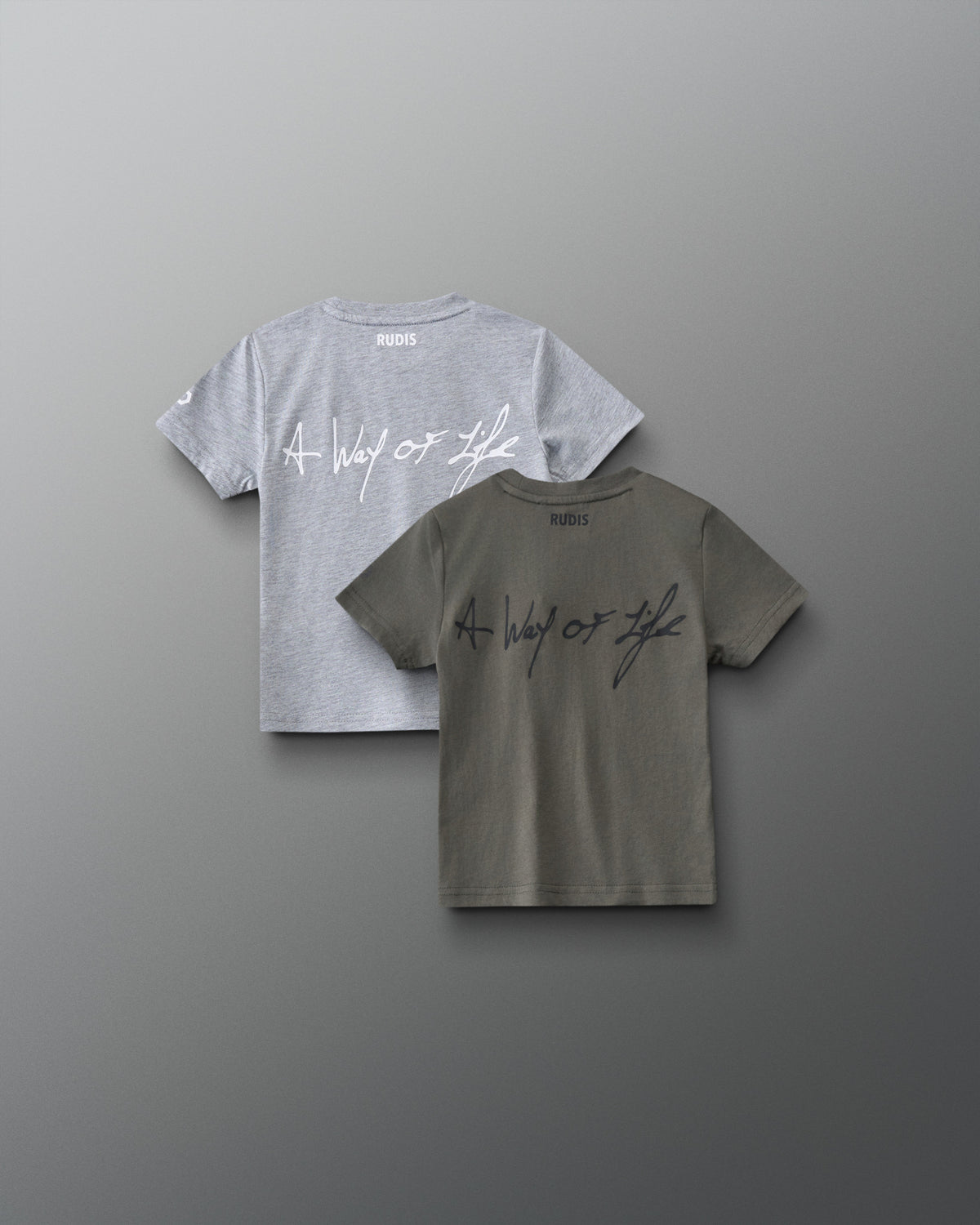 Back view of RUDIS Motto Scripted toddler t-shirts in olive and gray, featuring A Way of Life script graphics and RUDIS branding below the neckline.