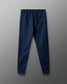 Navy blue jogger pants on a gray background