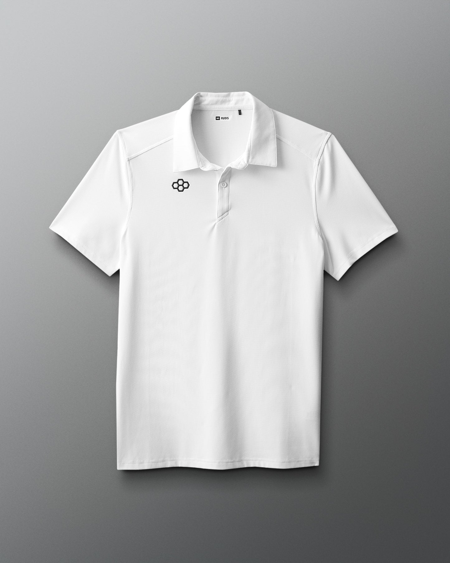 White polo shirt with a logo on a gray background