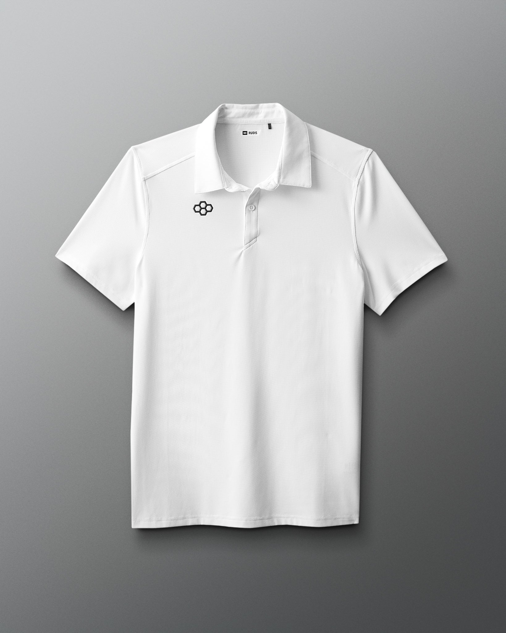 White polo shirt with a logo on a gray background