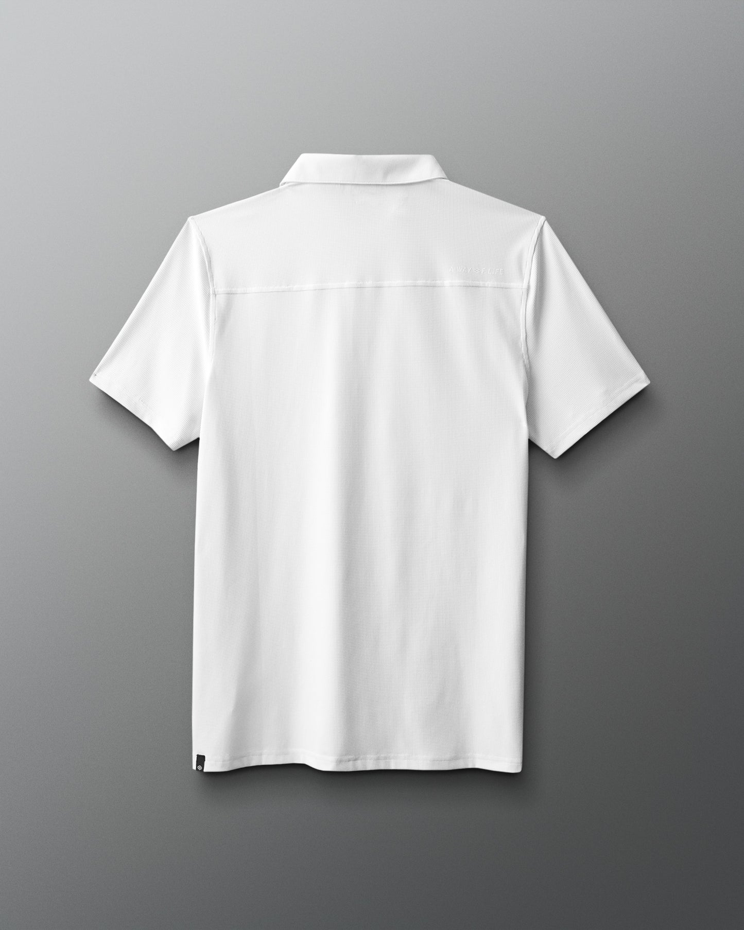 White polo shirt on a gray background
