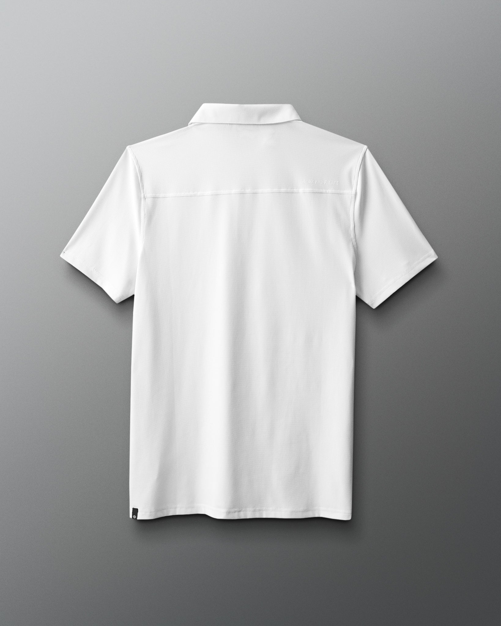 White polo shirt on a gray background