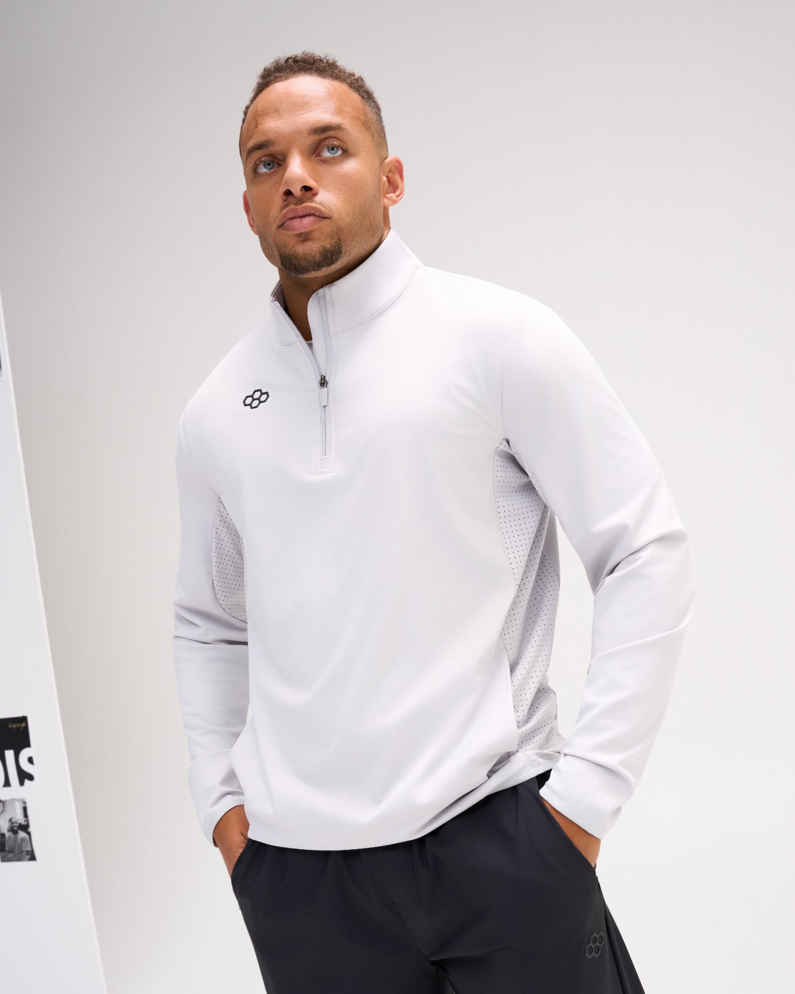 Model wearing the Lunar RUDIS Victory 1/4 Zip performance pullover with stand collar, quarter-zip closure, and ventilated side panels.