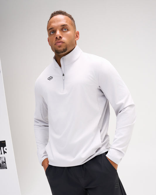 Model wearing the Lunar RUDIS Victory 1/4 Zip performance pullover with stand collar, quarter-zip closure, and ventilated side panels.