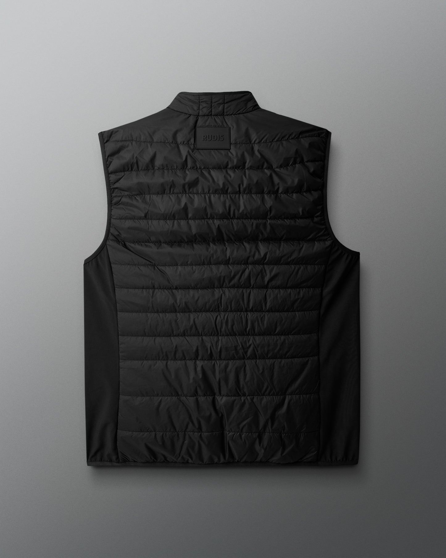 Black puffer vest on a light gray background