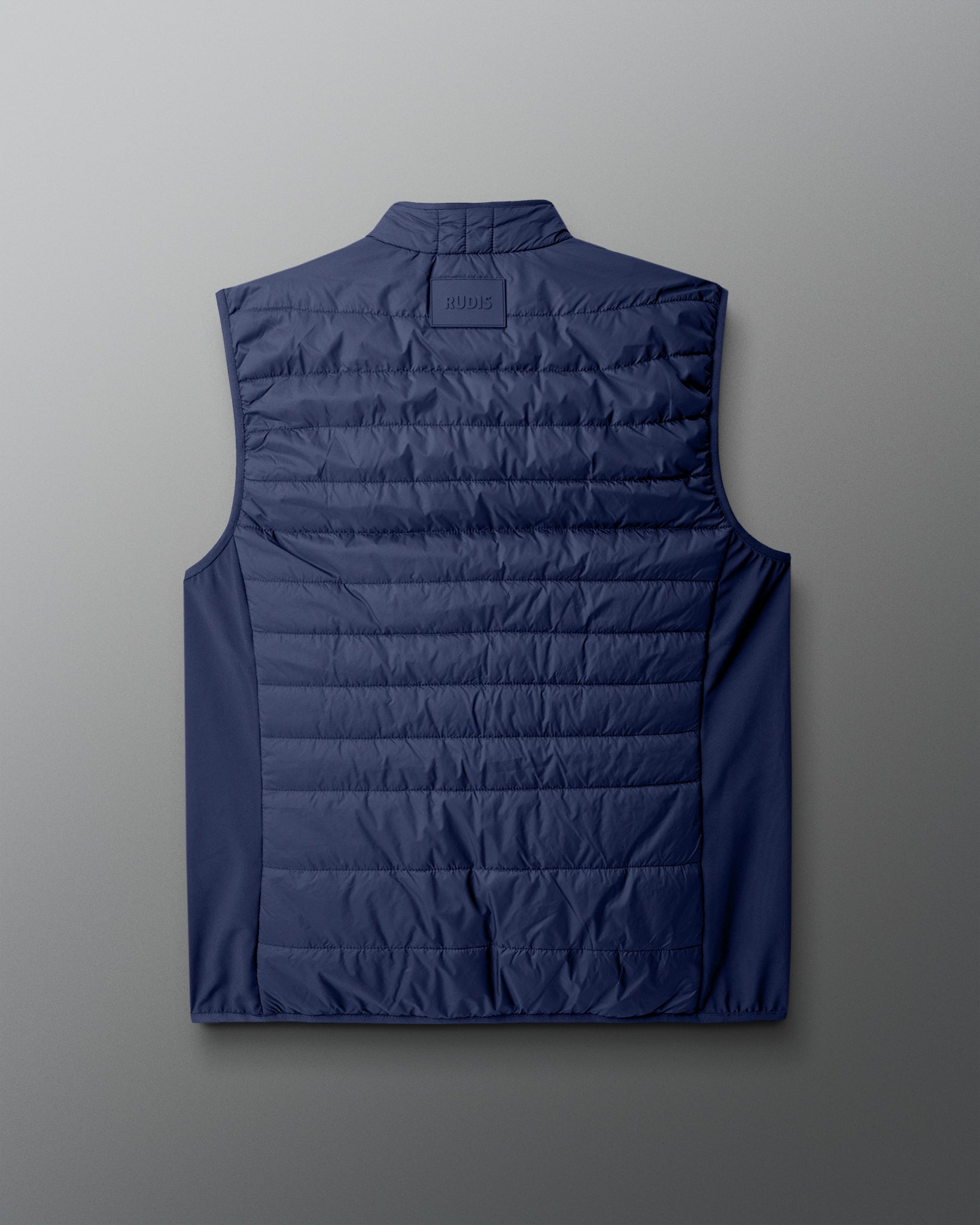 Blue puffer vest on a light gray background