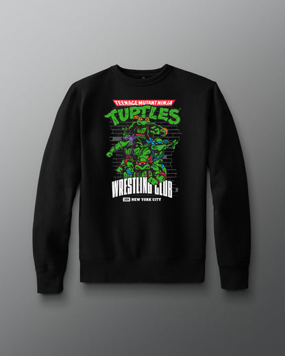 Black sweatshirt with Teenage Mutant Ninja Turtles graphic on a gray background