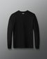 Black long-sleeve shirt on a gray background