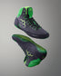 Pair of green and black Wrestling shoes on a gray background