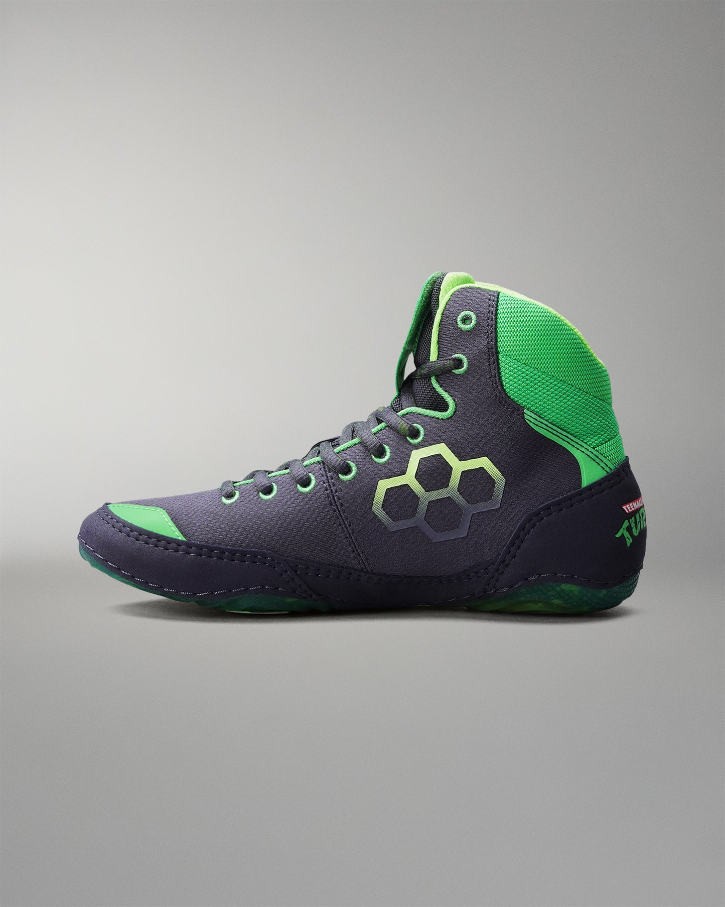 Gray and green Wrestling shoe on a gray background
