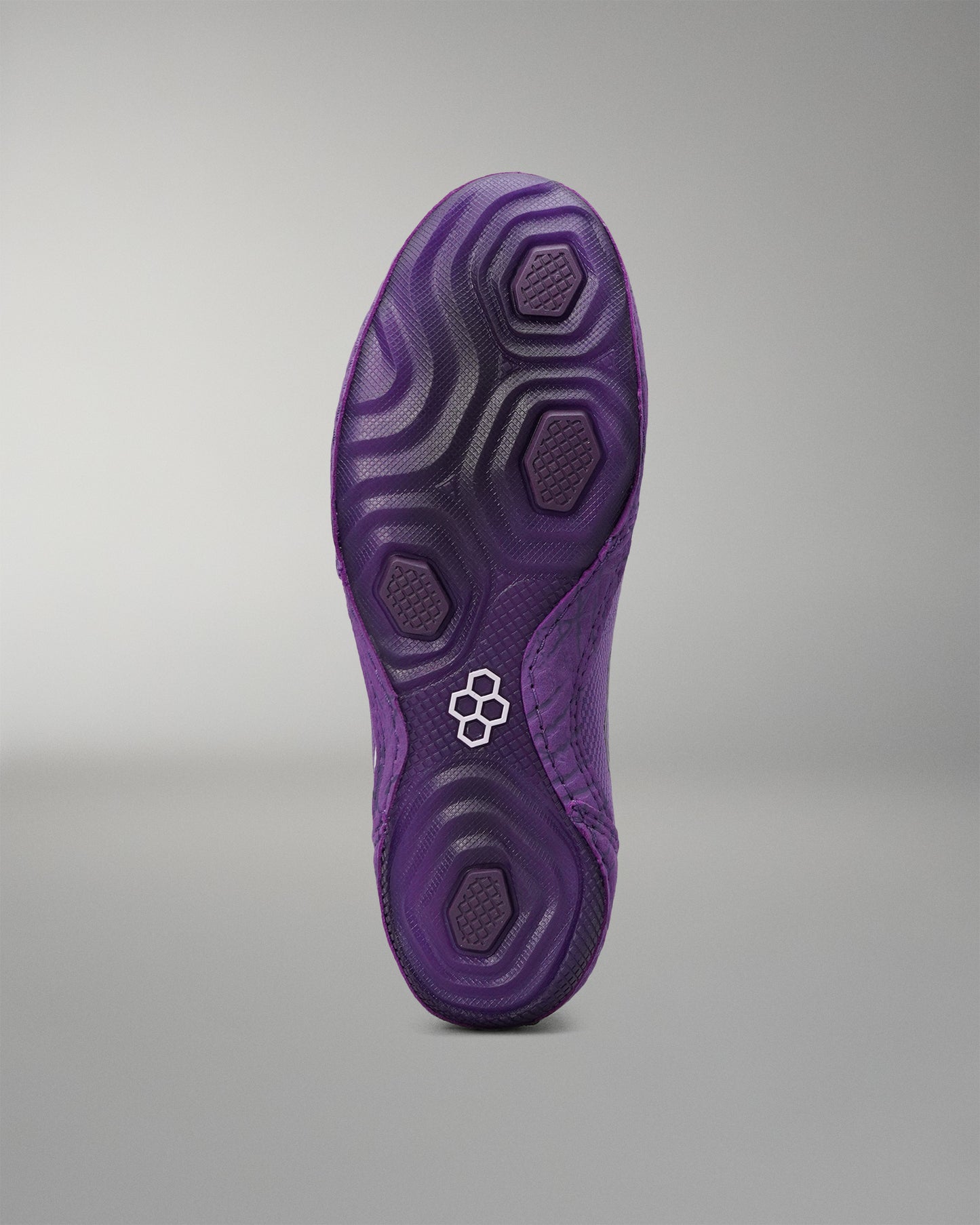 Purple outsole of the RUDIS Colt 4.0 Shredder wrestling shoe.
