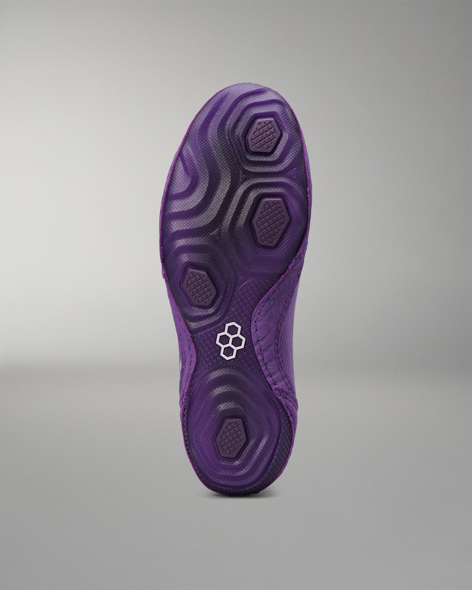 Purple outsole of the RUDIS Colt 4.0 Shredder wrestling shoe.