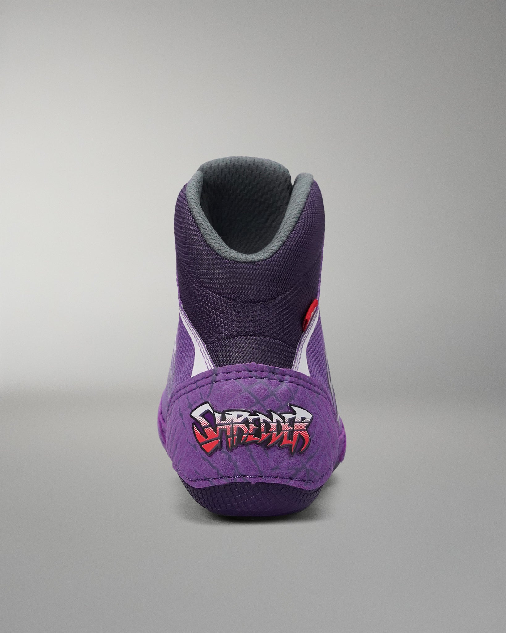 Rear view of the RUDIS Colt 4.0 Shredder wrestling shoe in purple, featuring exclusive Shredder heel branding, a padded high-top collar, and a performance-focused design built for comfort and support on the mat.
