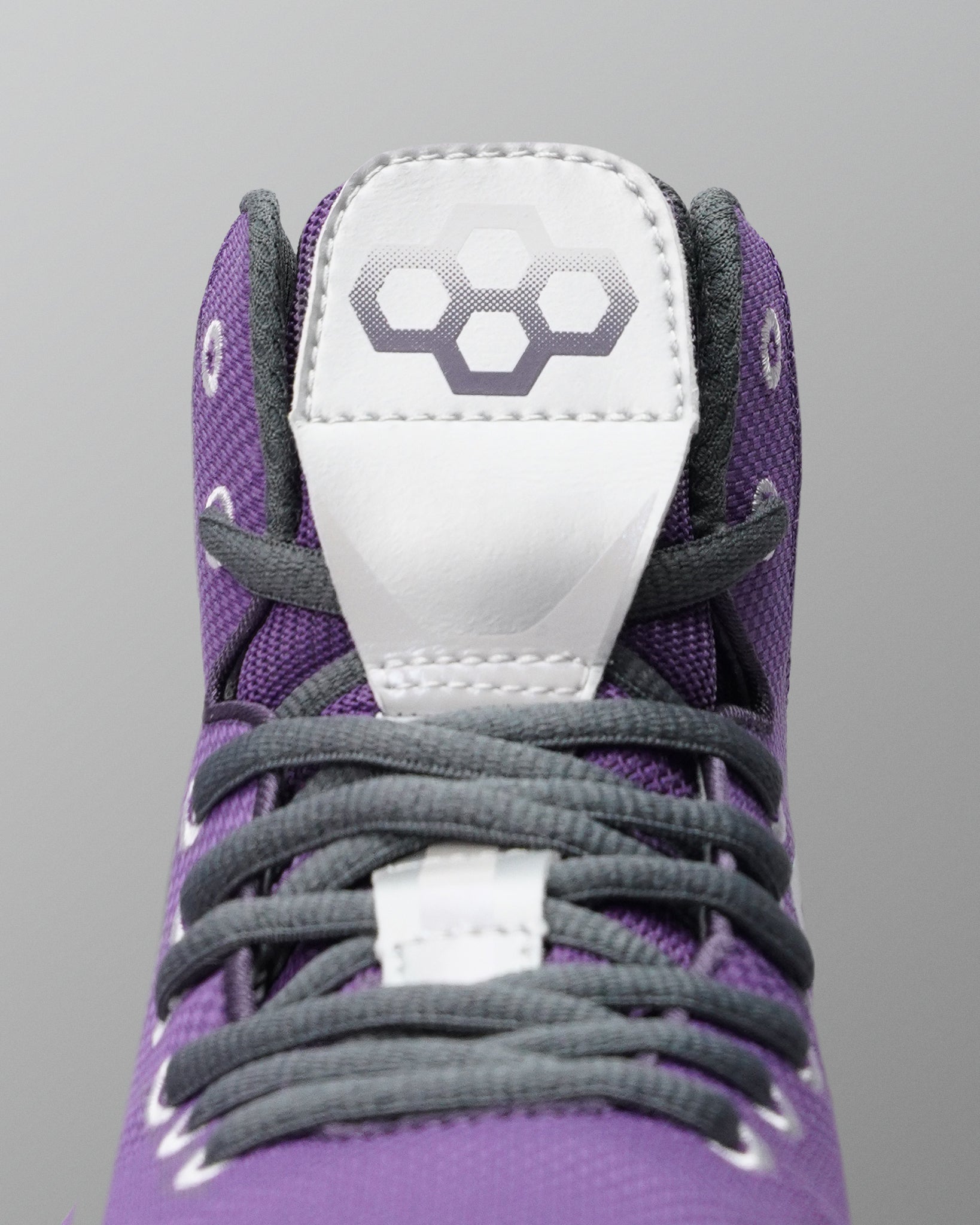 Close-up of the RUDIS Colt 4.0 Shredder wrestling shoe tongue and lace system.