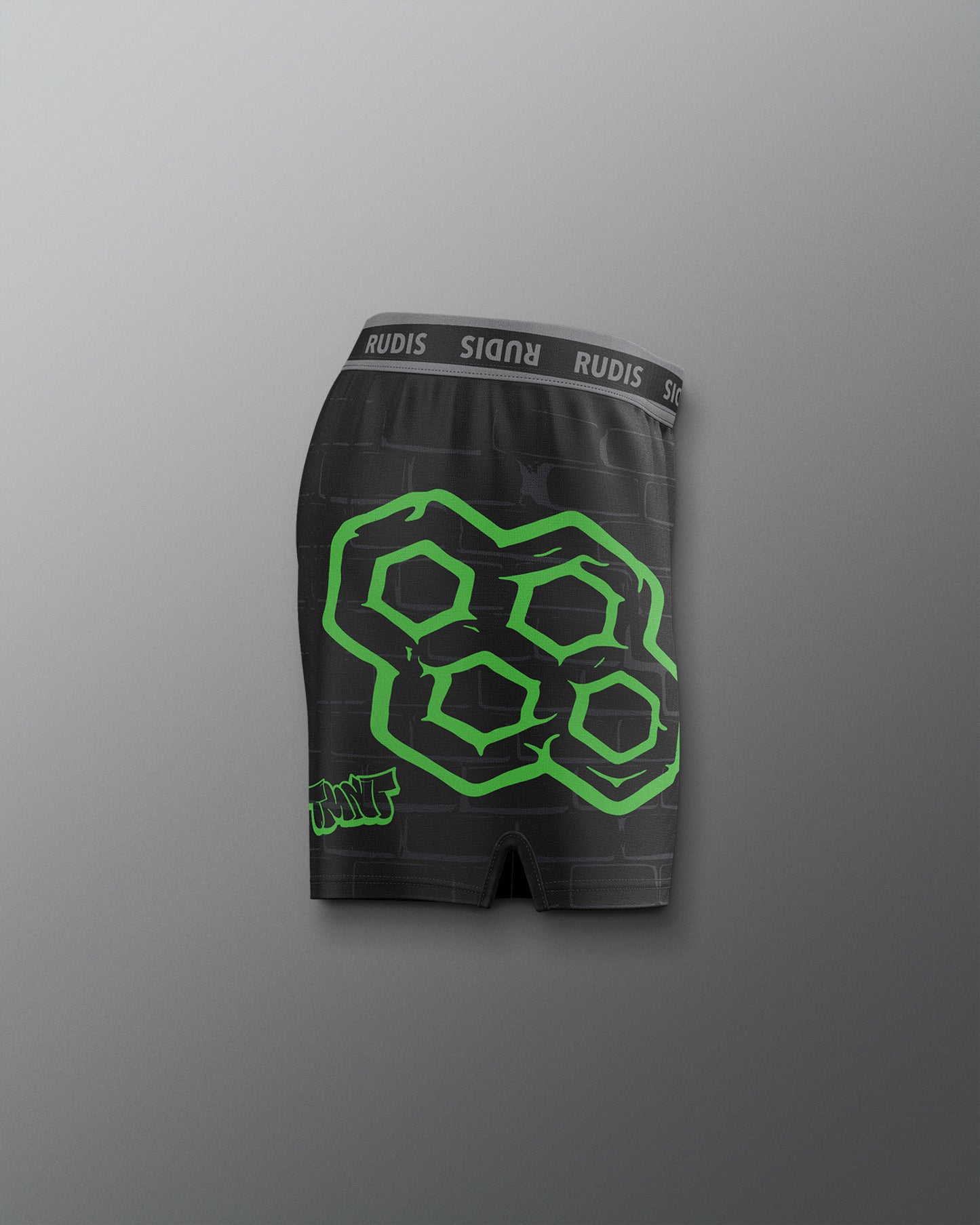 Black boxer briefs with green geometric pattern and 'RUDIS' branding on a gray background. TMNT. Teenage Mutant Ninja Turtle