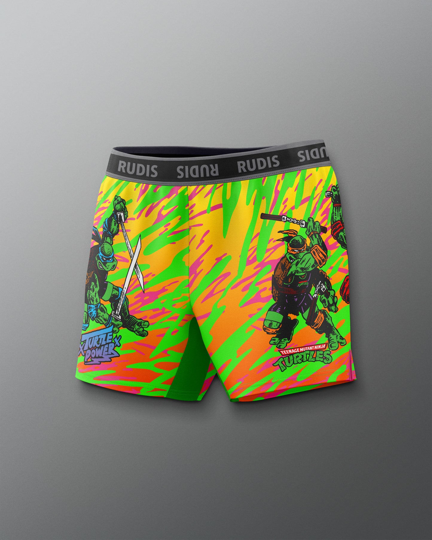 Colorful shorts with a graphic design on a gray background