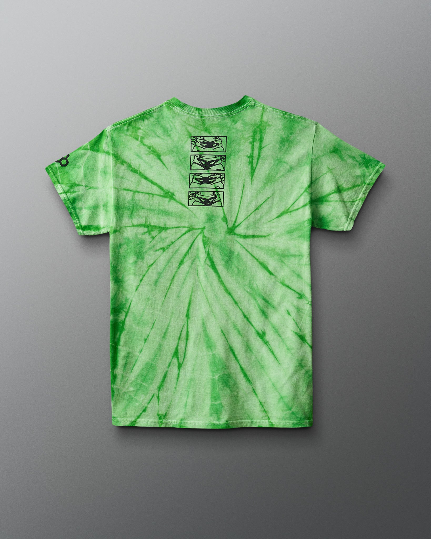 Green tie-dye t-shirt with graphic design on a gray background. TMNT. Teenage Mutant Ninja Turtles