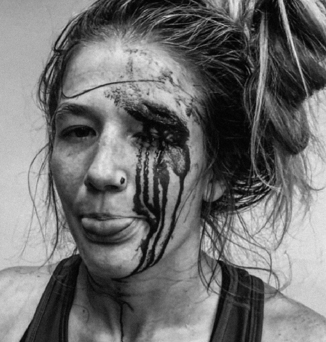 Team USA wrestler Sarah Hildebrandt with blood on her face after competition, embodying toughness, resilience, and the relentless spirit of women’s wrestling.