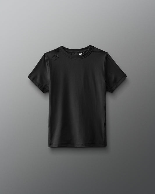 A black performance t-shirt showcases a minimalist design with short sleeves and a round neckline, featuring a small logo on one shoulder, suitable for athletic or casual wear.