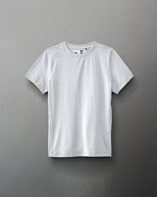 A light gray athletic shirt with a round neck and short sleeves features a subtle logo on the shoulder, designed for sports or casual use.